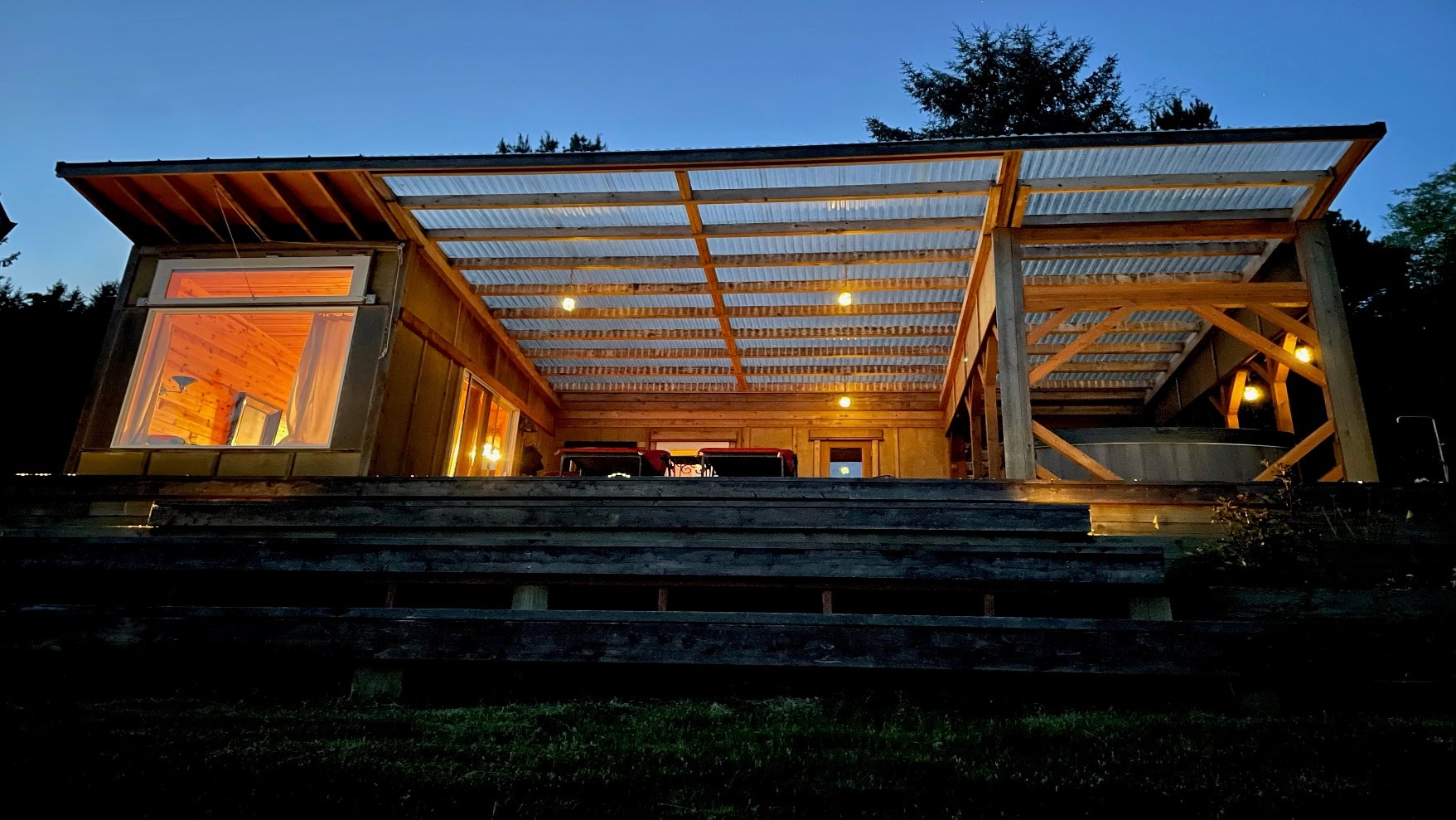 a picture containing sky, outdoor, grass, building  description