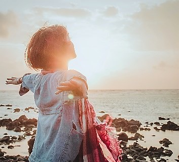 A baby standing on a beach Description automatically generated with low confidence (Less important)