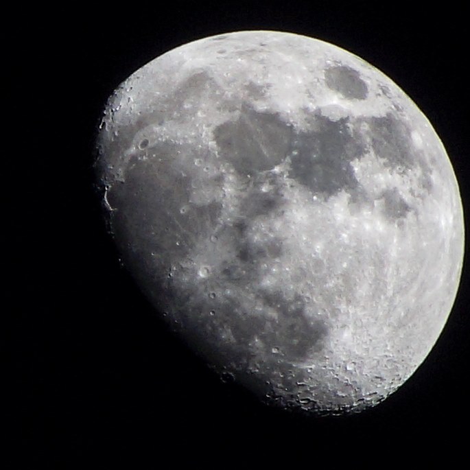 A detailed image of the moon as seen from a telescope.